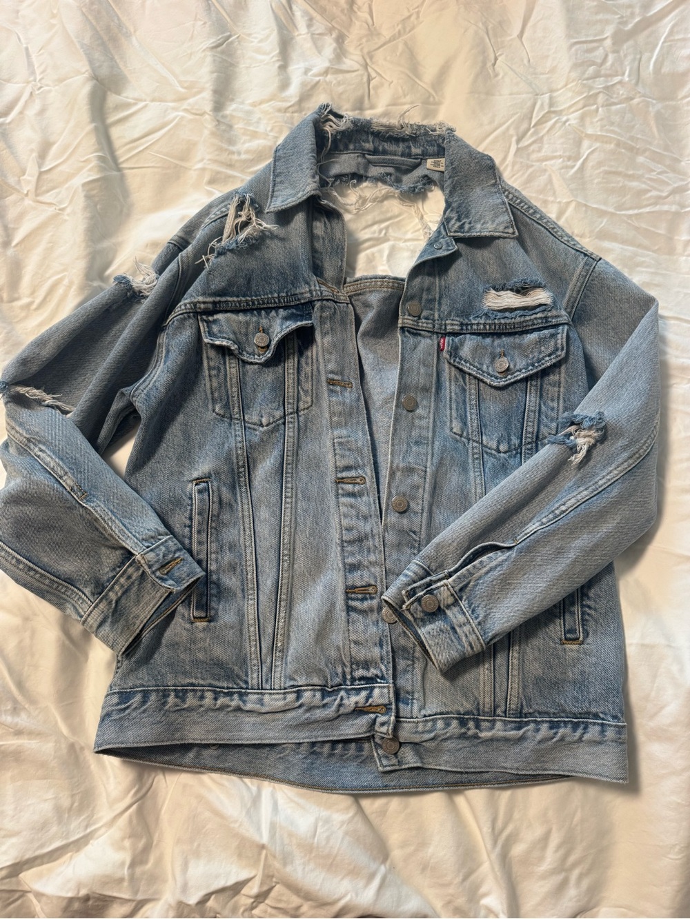 Levi’s Distressed Oversized Light Wash Denim Trucker Jacket